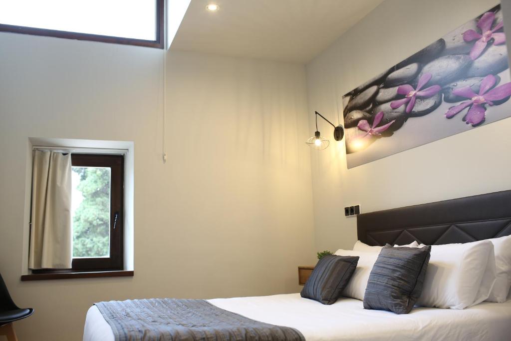 Posteľ alebo postele v izbe v ubytovaní Priorat Boutique