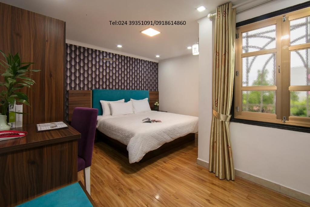 Postel nebo postele na pokoji v ubytování golden time hostel