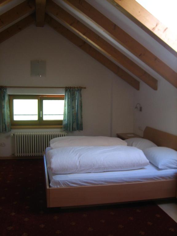 Postel nebo postele na pokoji v ubytování Garni - Appartement Neumairhof