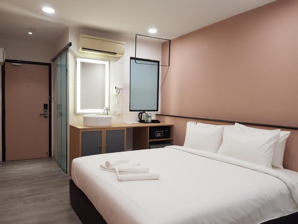 Postel nebo postele na pokoji v ubytování Bloommaze Boutique Hotel Klang