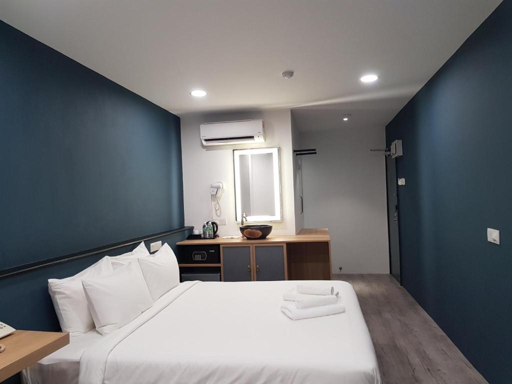 Postel nebo postele na pokoji v ubytování Bloommaze Boutique Hotel Klang