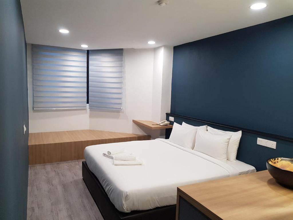 Postel nebo postele na pokoji v ubytování Bloommaze Boutique Hotel Klang