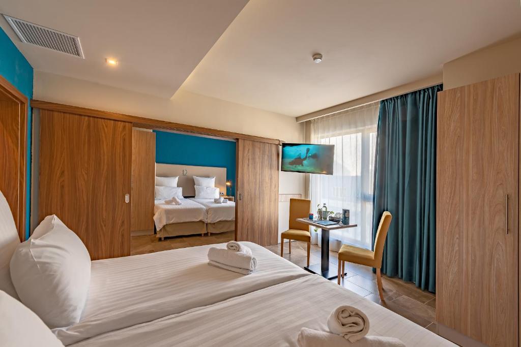 Postel nebo postele na pokoji v ubytování Ddream Hotel