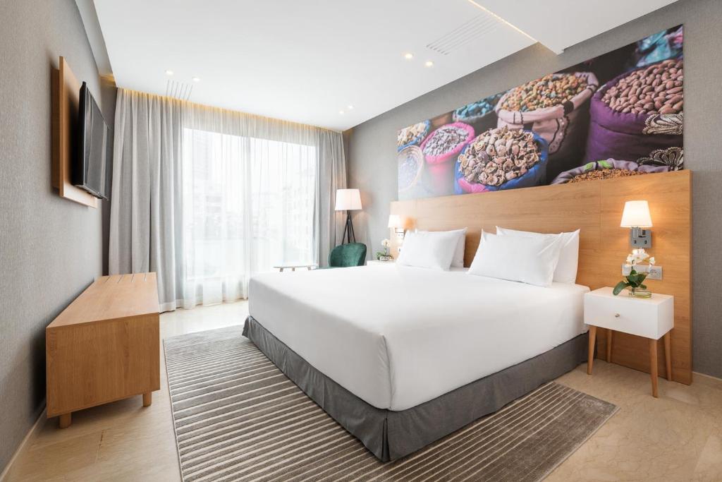 Postel nebo postele na pokoji v ubytování Mid Town Hotel Casablanca