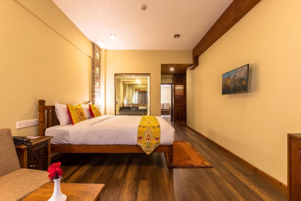 Postel nebo postele na pokoji v ubytování Hotel Mala Pokhara