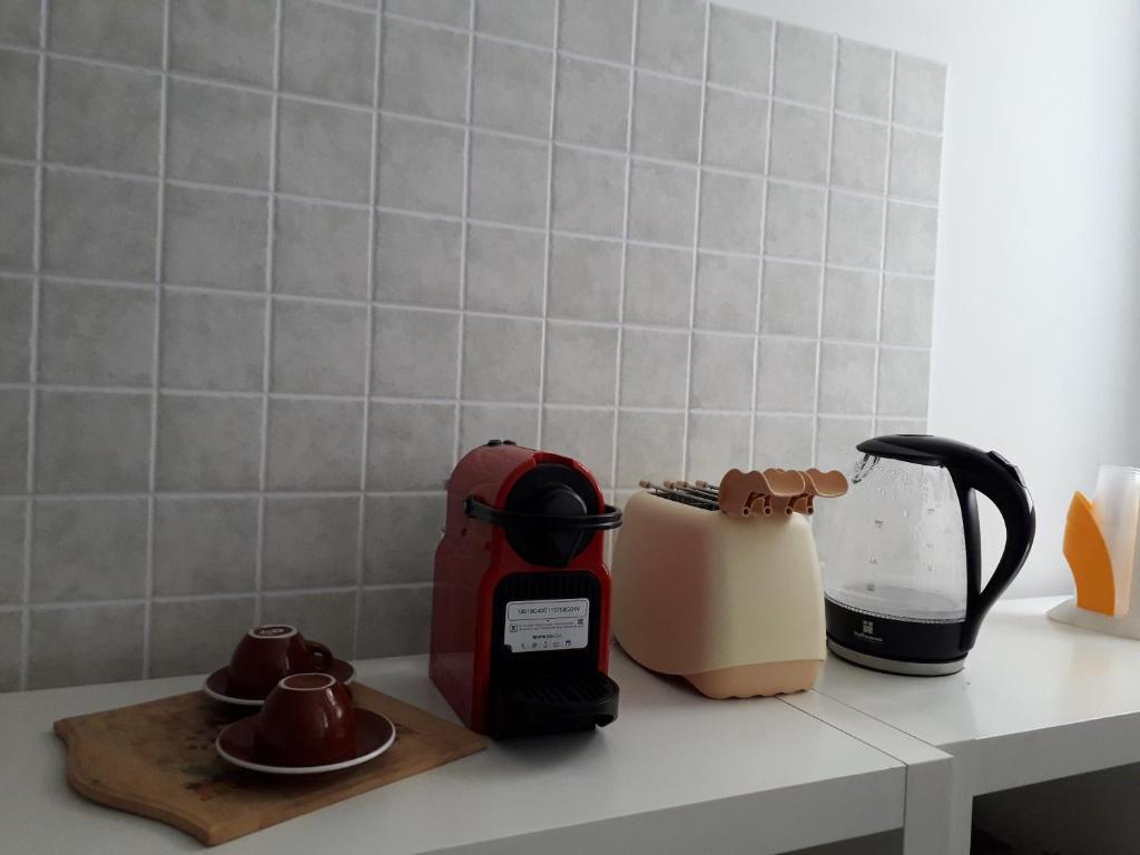 Příslušenství pro přípravu čaje a kávy v ubytování Gymnasium