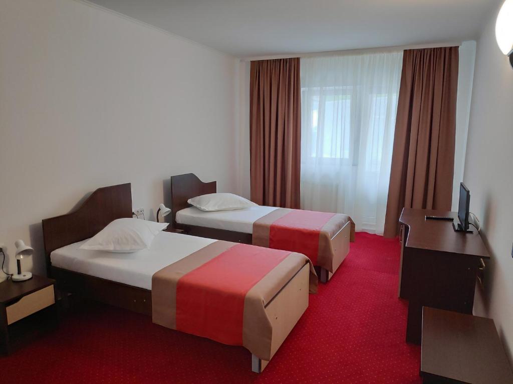 Postel nebo postele na pokoji v ubytování Hostel Caliman