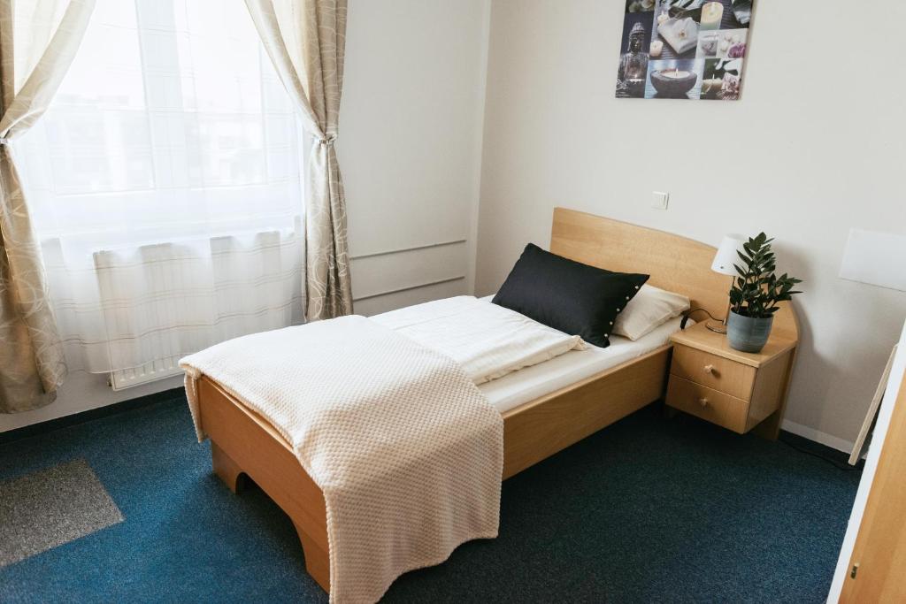 Postel nebo postele na pokoji v ubytování Restaurant Gästehaus Feldkirchen