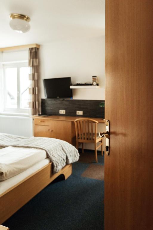 Postel nebo postele na pokoji v ubytování Restaurant Gästehaus Feldkirchen