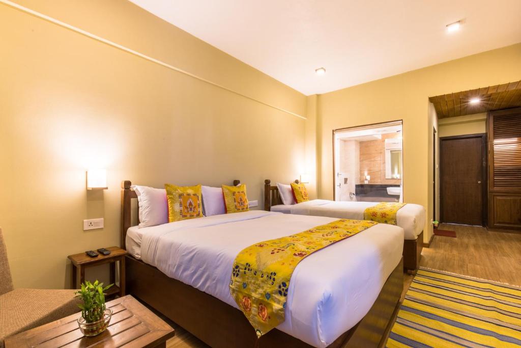 Postel nebo postele na pokoji v ubytování Hotel Mala Pokhara