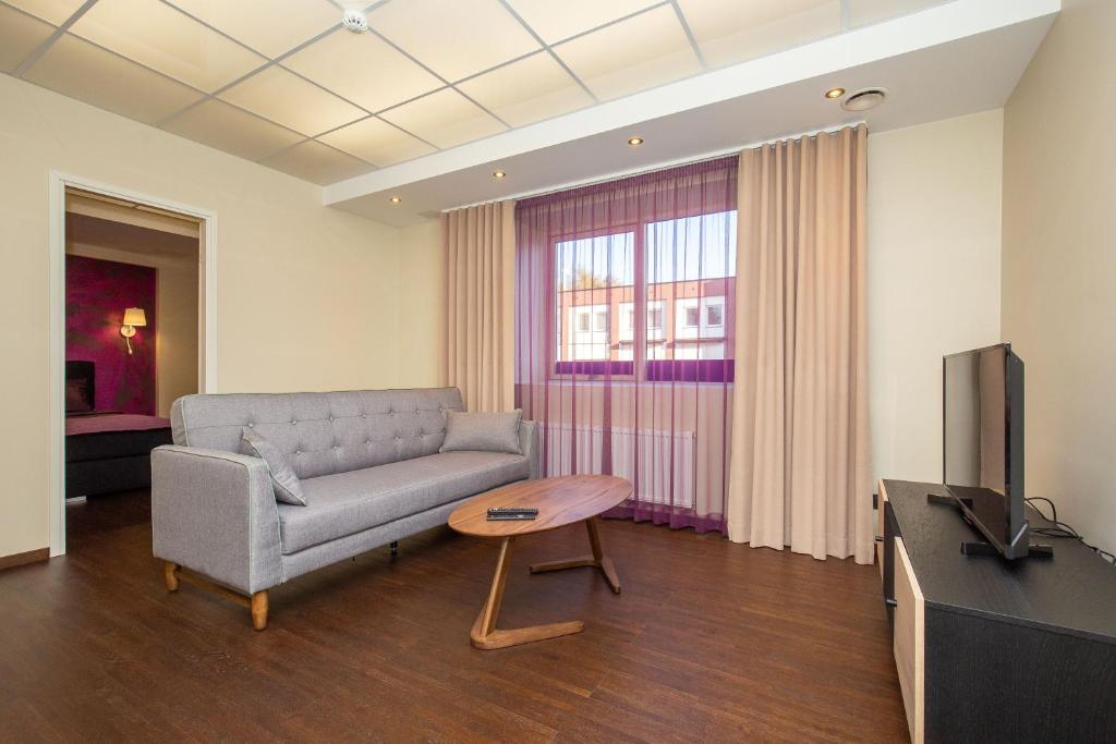 TV a/nebo společenská místnost v ubytování P54 Apartment