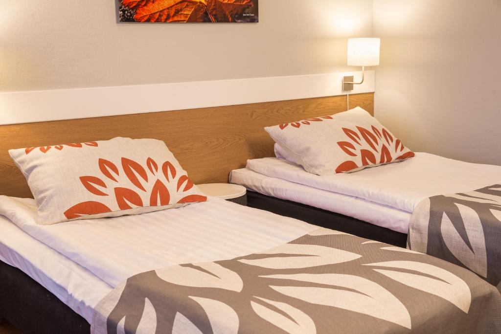 Postel nebo postele na pokoji v ubytování Park Hotel Tornio