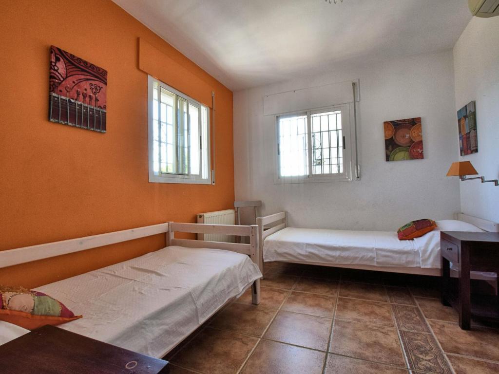 Posteľ alebo postele v izbe v ubytovaní Belvilla by OYO Casa Iris