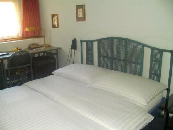 Postel nebo postele na pokoji v ubytování Hotel Park Villa