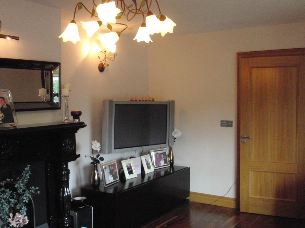 TV a/nebo společenská místnost v ubytování Woodlands House