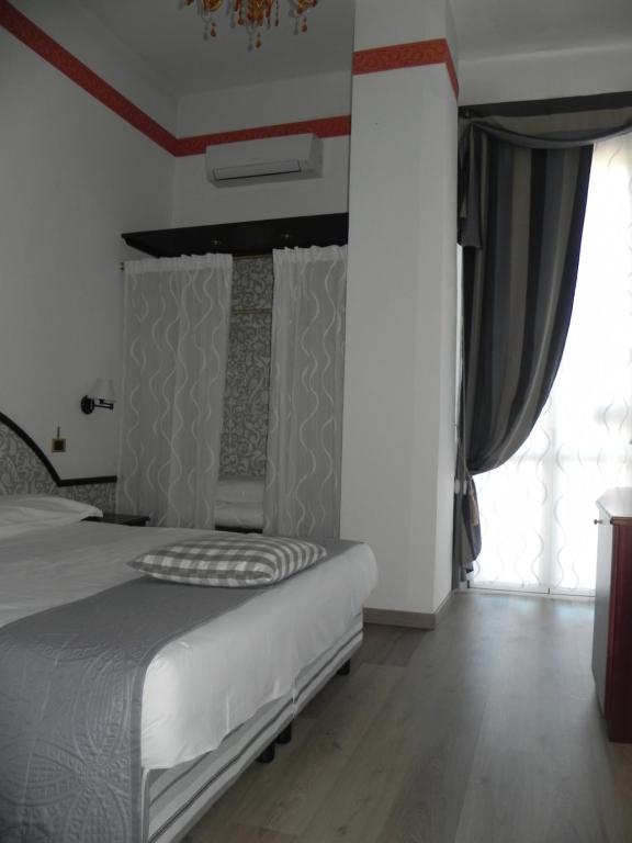 Postel nebo postele na pokoji v ubytování Hotel Helios