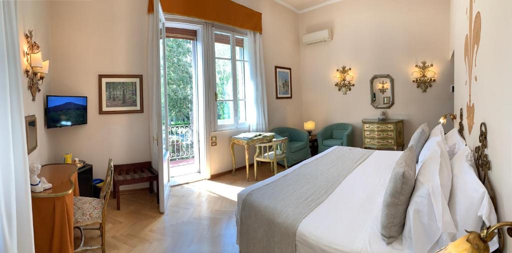 Postel nebo postele na pokoji v ubytování Hotel David