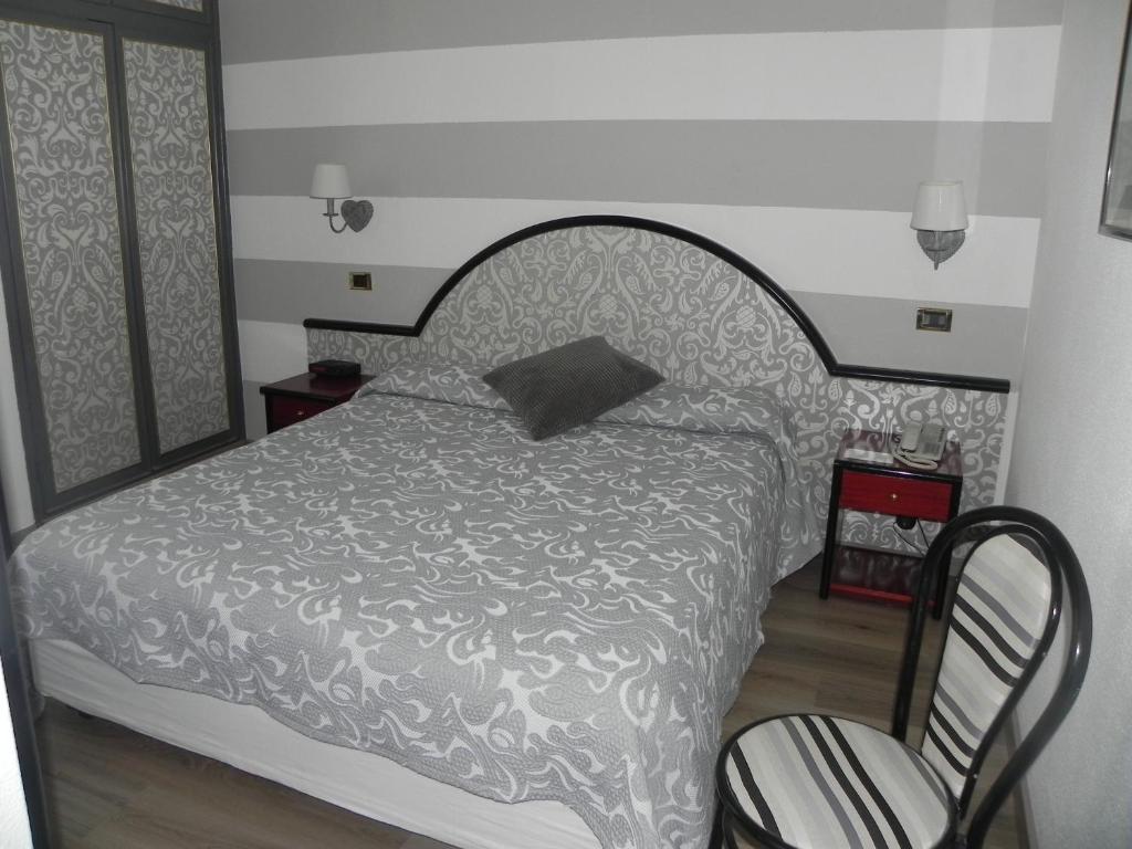 Postel nebo postele na pokoji v ubytování Hotel Helios