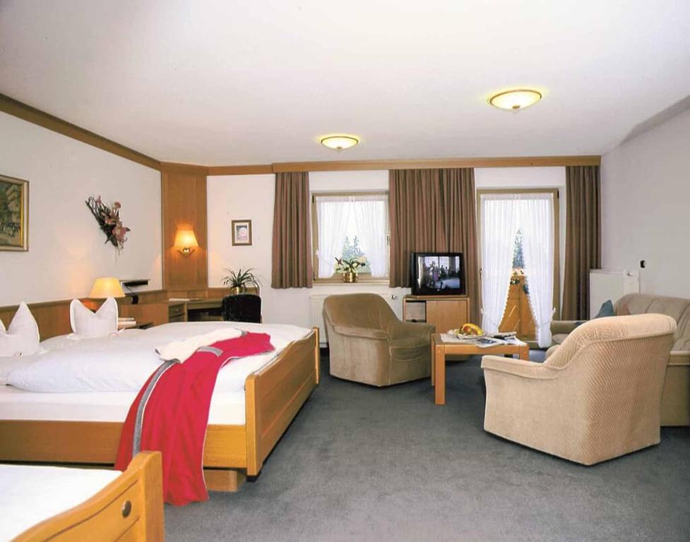 Postel nebo postele na pokoji v ubytování Hotel Märchenwald