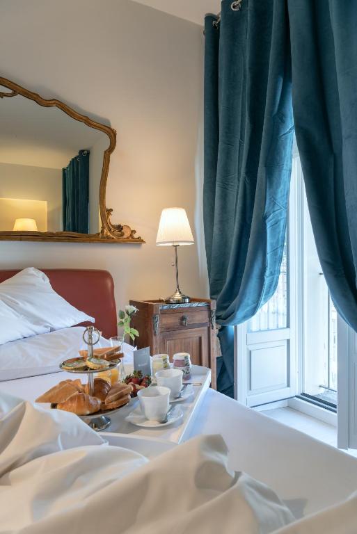 Postel nebo postele na pokoji v ubytování Corte Realdi Luxury Rooms Torino