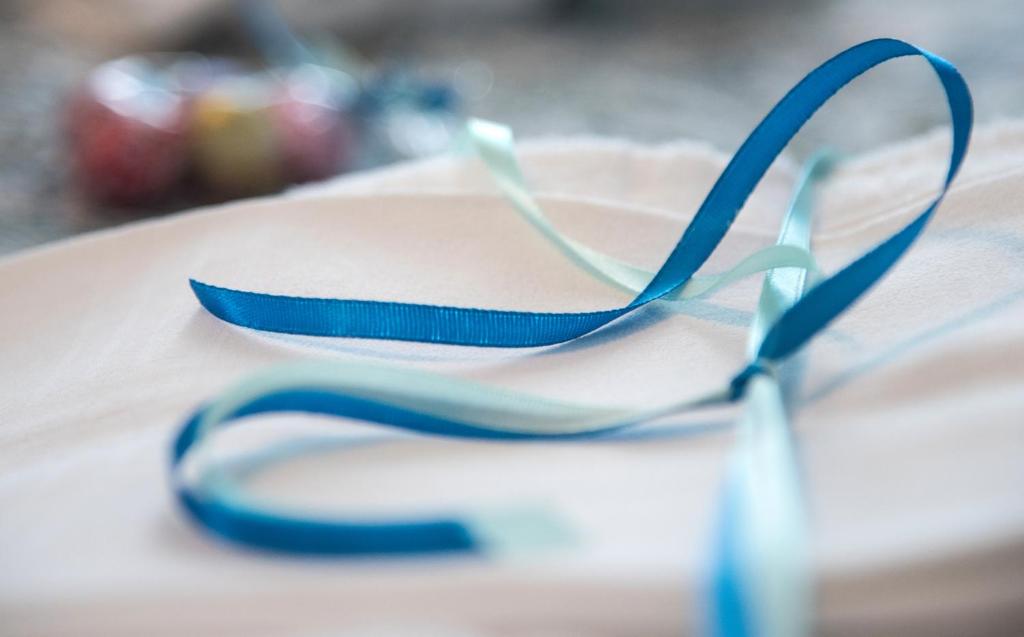 a pair of blue glasses sitting on top of a table at Hotel Acquamarina in Portoferraio