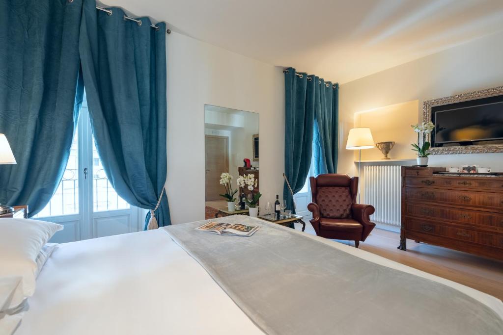Postel nebo postele na pokoji v ubytování Corte Realdi Luxury Rooms Torino