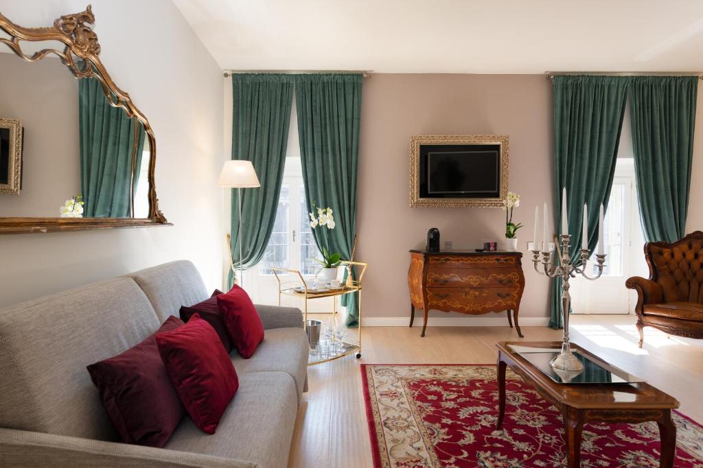 TV a/nebo společenská místnost v ubytování Corte Realdi Luxury Rooms Torino