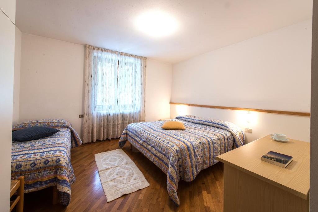 Postel nebo postele na pokoji v ubytování Residence Stefenine