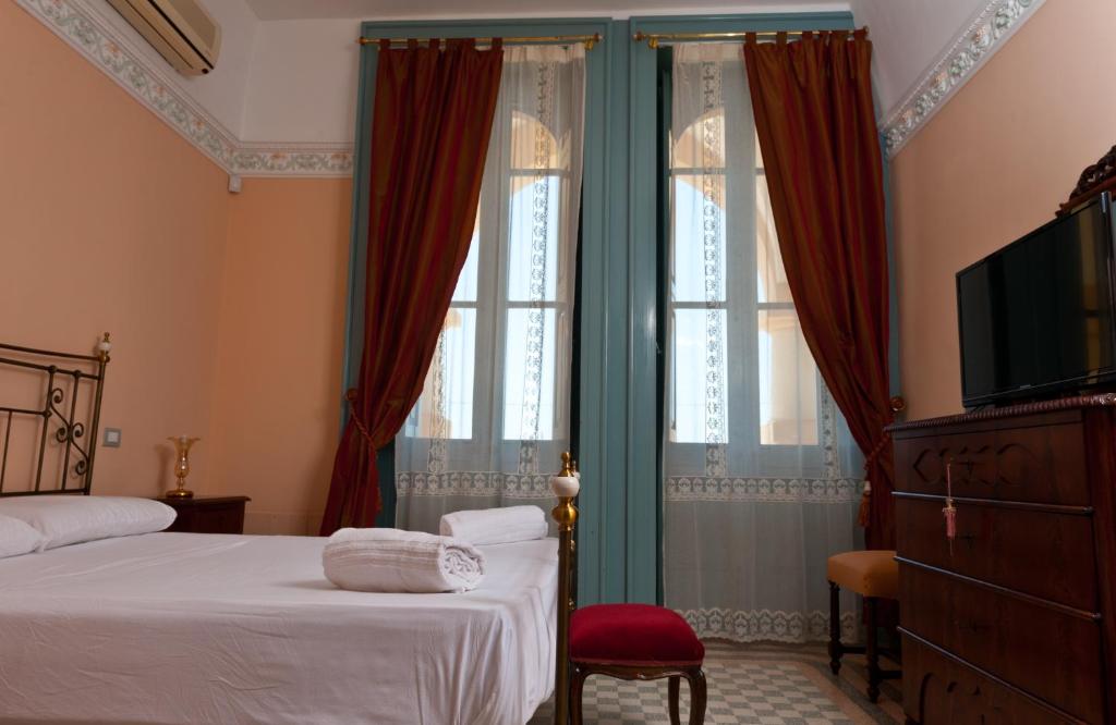 Postel nebo postele na pokoji v ubytování Villa Raffaella