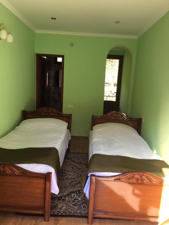 Postel nebo postele na pokoji v ubytování Dilbo House