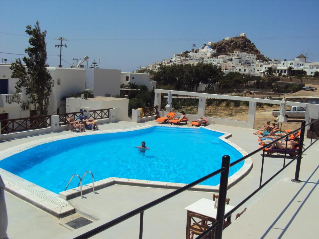 a swimming pool on the roof of a hotel at Golden Star in Ios Chora