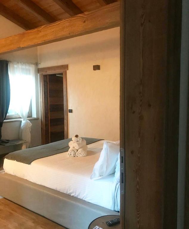Postel nebo postele na pokoji v ubytování B&B Lo Matsòn