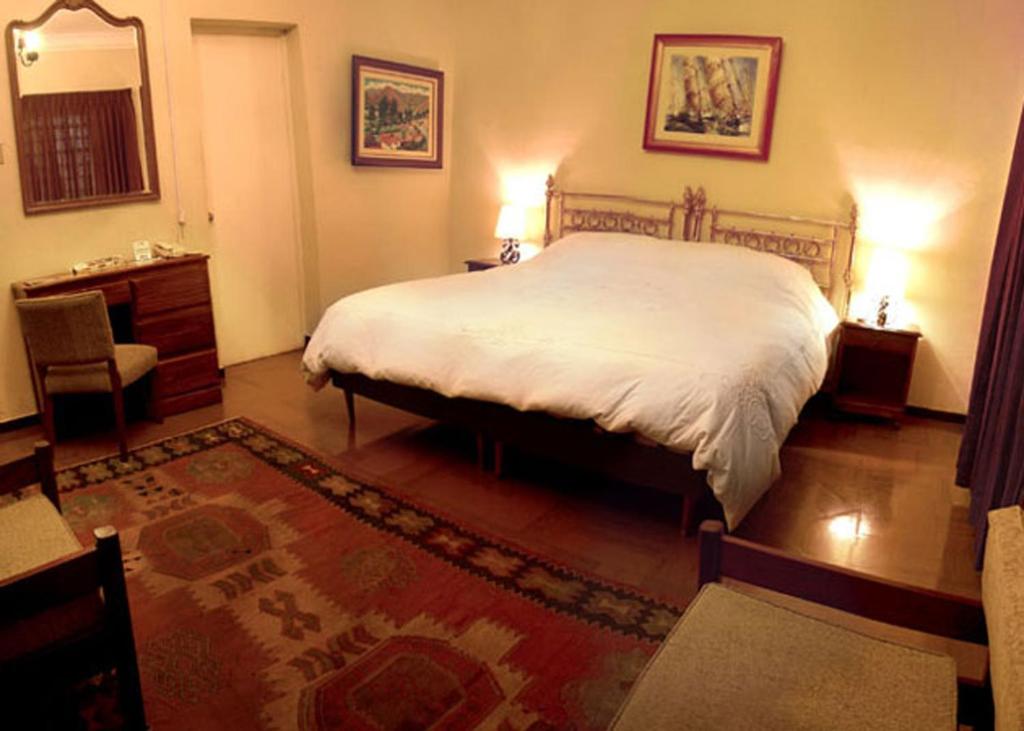 Postel nebo postele na pokoji v ubytování Hotel Majoro