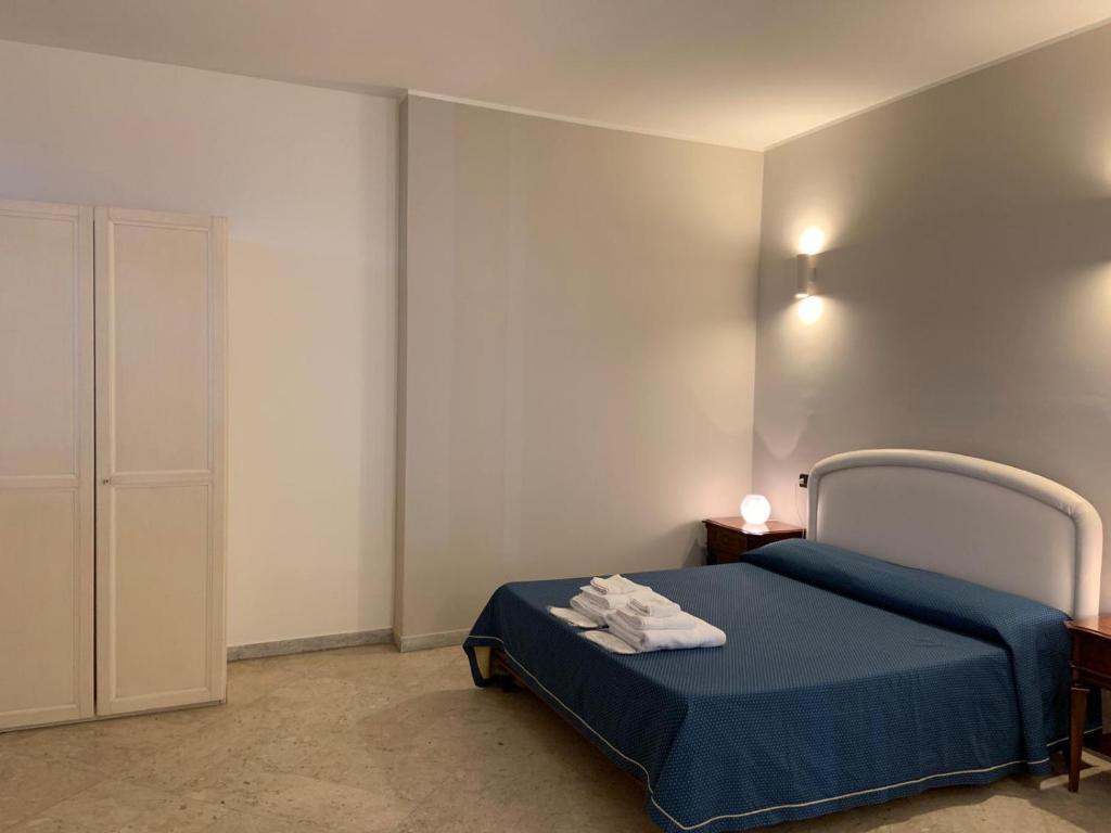 Postel nebo postele na pokoji v ubytování Hotel Lungomare