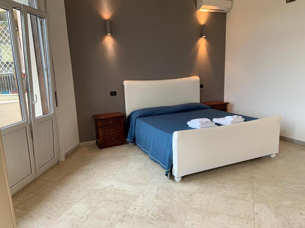 Postel nebo postele na pokoji v ubytování Hotel Lungomare
