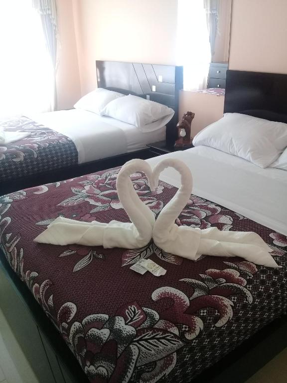 Postel nebo postele na pokoji v ubytování Kucha Wasi Hosteria