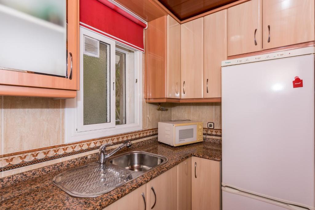 Kuchyňa alebo kuchynka v ubytovaní HomeHolidaysRentals Vall III
