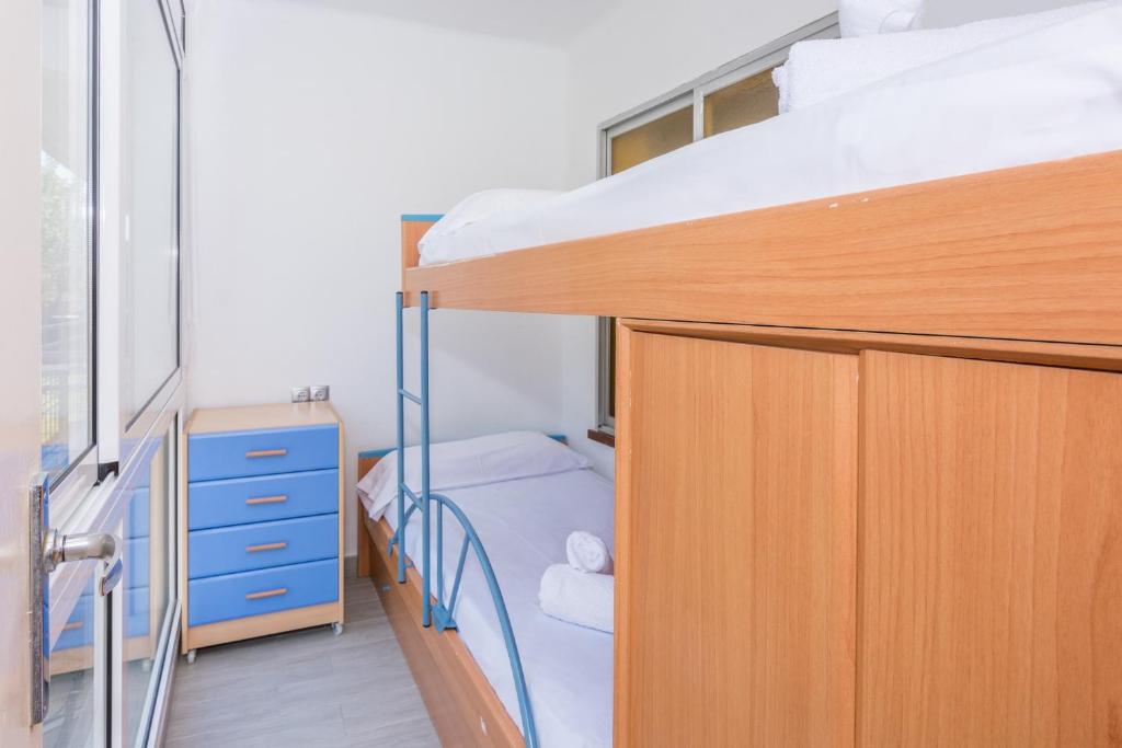 Posteľ alebo postele v izbe v ubytovaní HomeHolidaysRentals Vall III