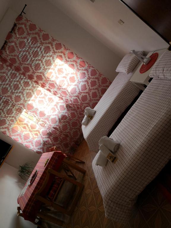 Een bed of bedden in een kamer bij B&B MANITO