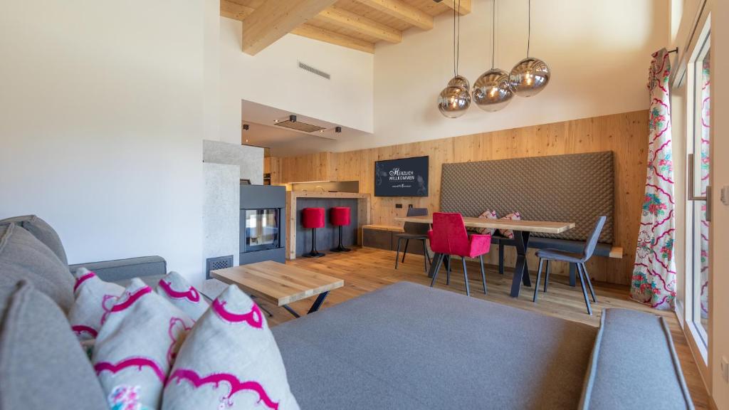 a living room with a couch and a table at Apartments Edenlehen in Mayrhofen