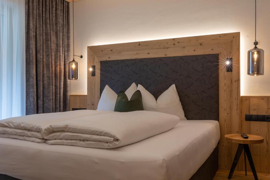 Postel nebo postele na pokoji v ubytování Apartments Edenlehen
