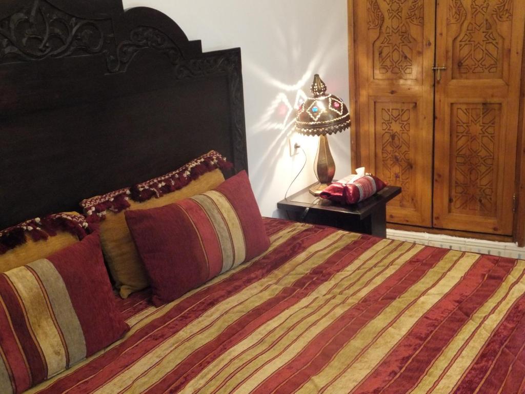Postel nebo postele na pokoji v ubytování Riad Mouna