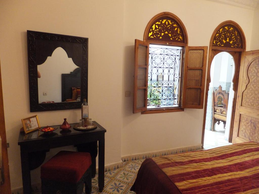 Postel nebo postele na pokoji v ubytování Riad Mouna