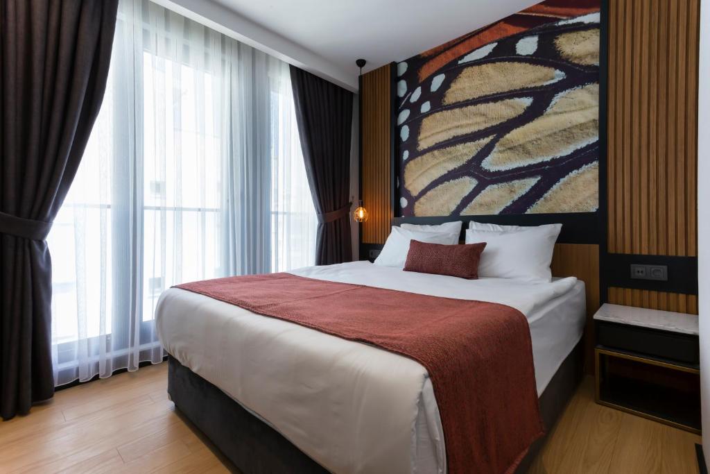 A bed or beds in a room at Nox Suite