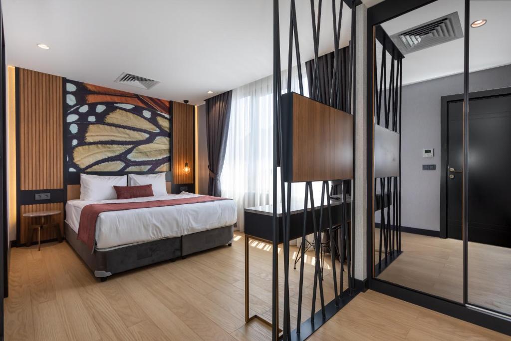 A bed or beds in a room at Nox Suite