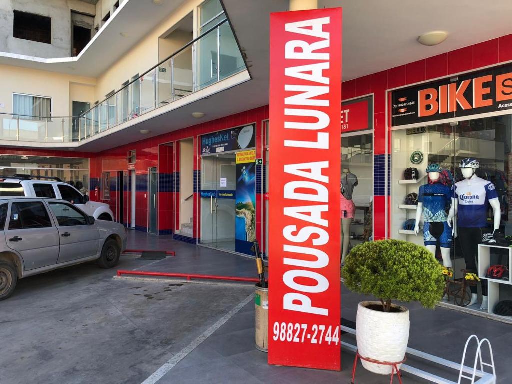 a store front with a car parked in front of it at POUSADA LUNARA in Jequié