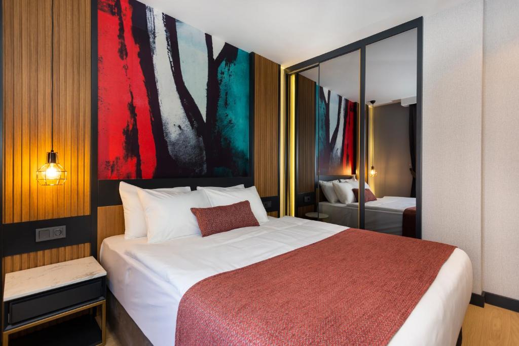 A bed or beds in a room at Nox Suite