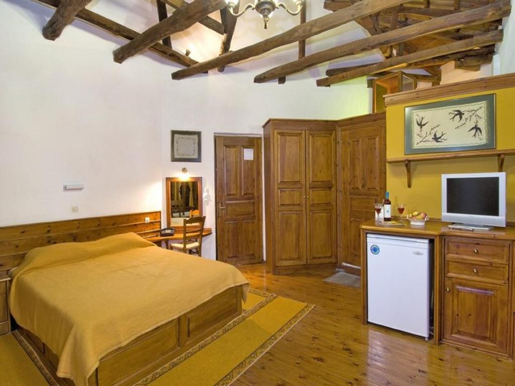 Łóżko lub łóżka w pokoju w obiekcie Hotel Stoikos