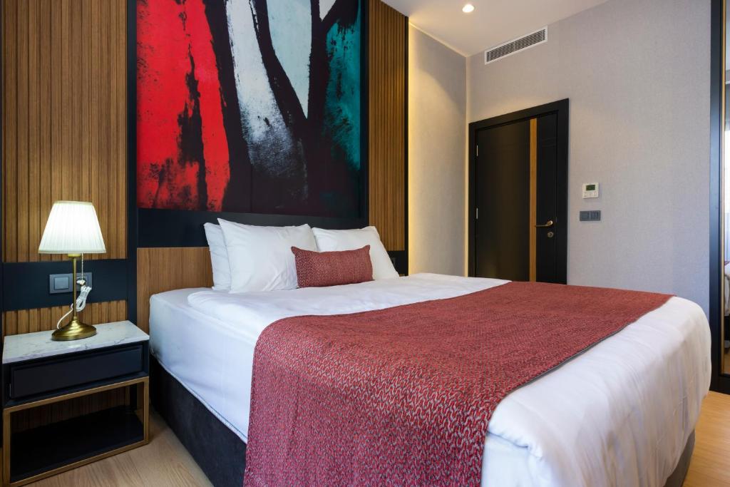 A bed or beds in a room at Nox Suite
