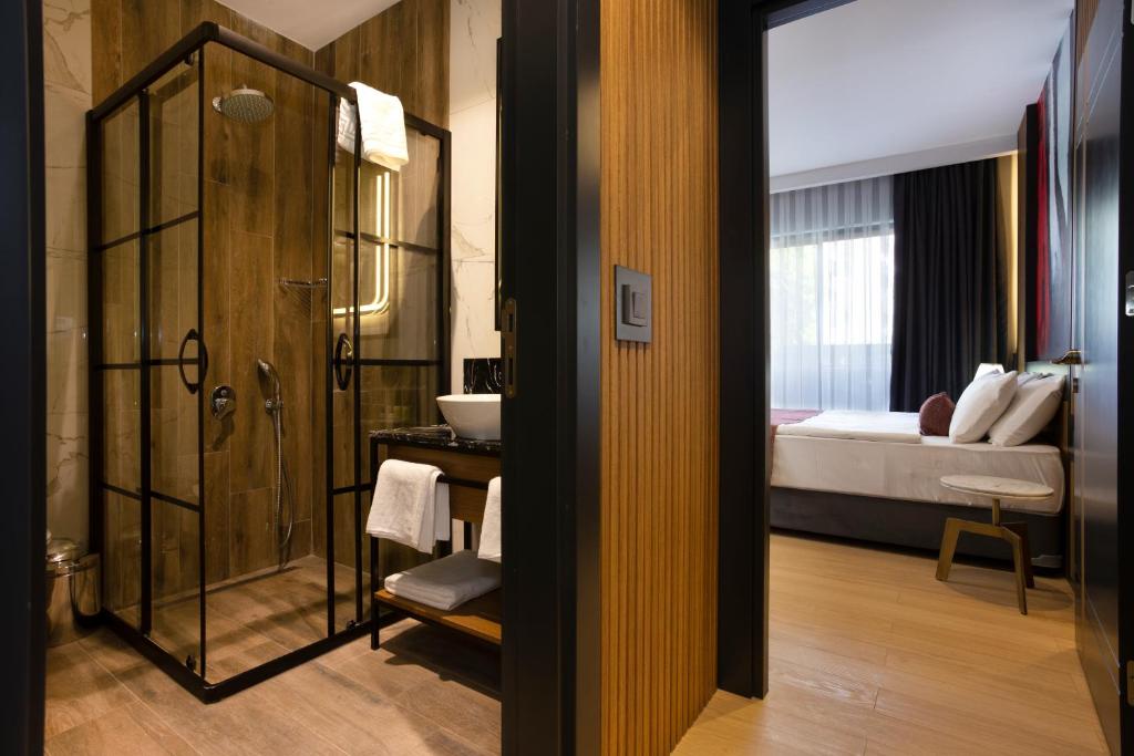A bed or beds in a room at Nox Suite